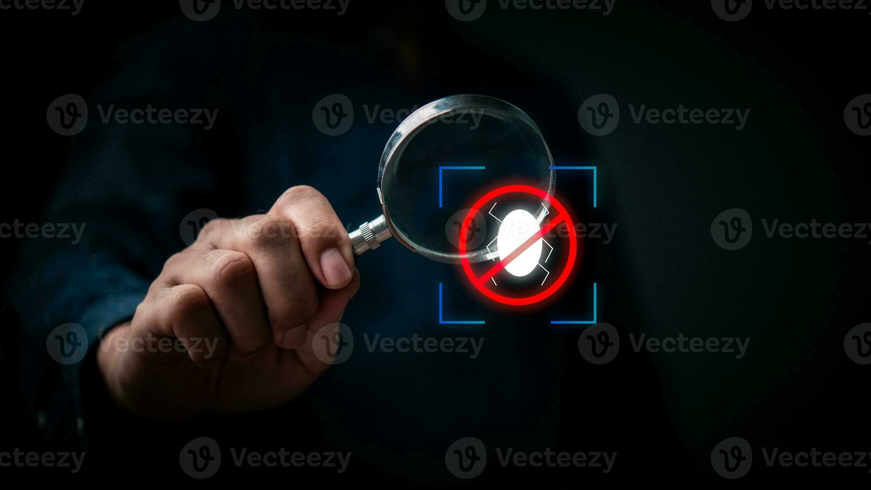 Hand holding a magnifying glass antivirus and spyware hacker icon.Theft prevention technology concept. photo