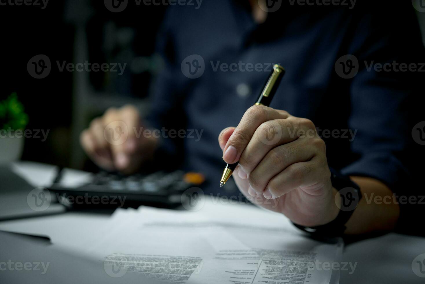 man holding pen with writing on paper report or signature law, contract at desk. photo