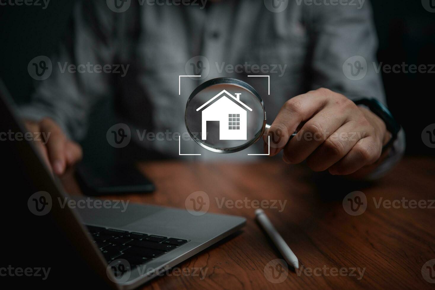 Man hold magnifying glass searching house. real estate agency, property insurance, mortgage loan or new home. photo