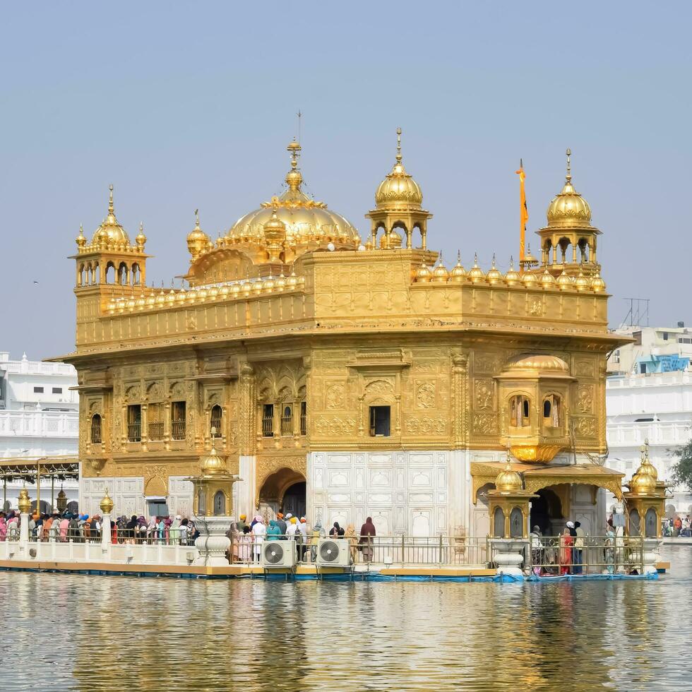 Amritsar, India - May 31 2023 - Beautiful view of Golden Temple - Harmandir Sahib in Amritsar, Punjab, India, Famous indian sikh landmark, Golden Temple, the main sanctuary of Sikhs in Amritsar, India photo