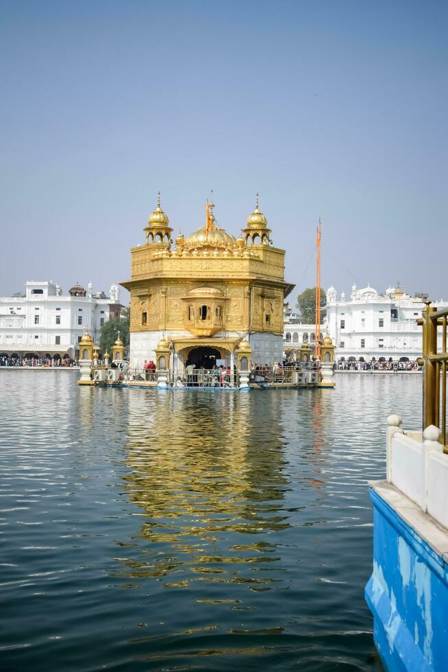 Amritsar, India - May 31 2023 - Beautiful view of Golden Temple - Harmandir Sahib in Amritsar, Punjab, India, Famous indian sikh landmark, Golden Temple, the main sanctuary of Sikhs in Amritsar, India photo