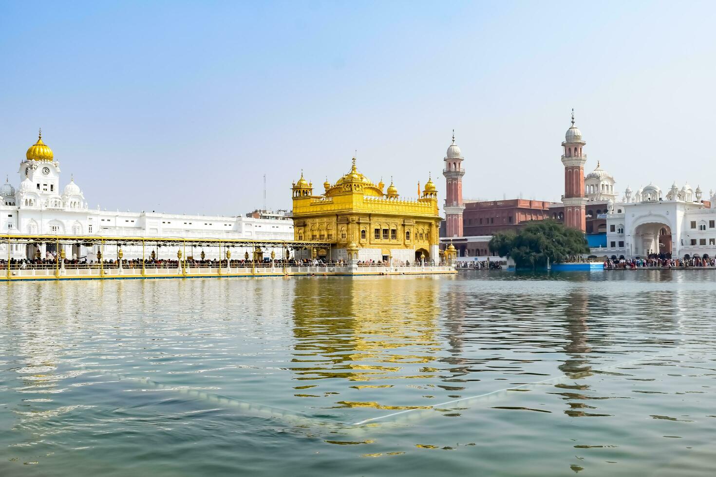 Amritsar, India - May 31 2023 - Beautiful view of Golden Temple - Harmandir Sahib in Amritsar, Punjab, India, Famous indian sikh landmark, Golden Temple, the main sanctuary of Sikhs in Amritsar, India photo