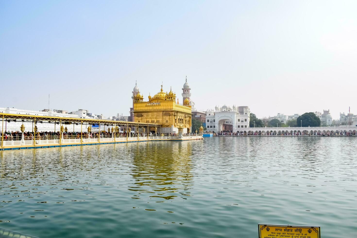 Amritsar, India - May 31 2023 - Beautiful view of Golden Temple - Harmandir Sahib in Amritsar, Punjab, India, Famous indian sikh landmark, Golden Temple, the main sanctuary of Sikhs in Amritsar, India photo