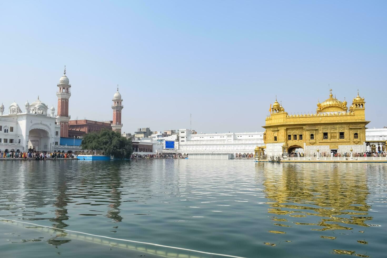 Amritsar, India - May 31 2023 - Beautiful view of Golden Temple - Harmandir Sahib in Amritsar, Punjab, India, Famous indian sikh landmark, Golden Temple, the main sanctuary of Sikhs in Amritsar, India photo