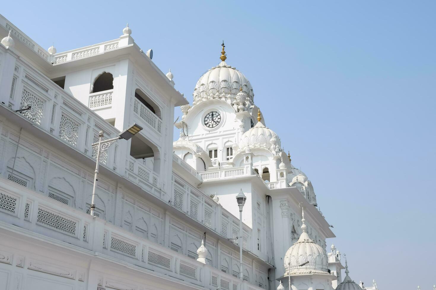 Amritsar, India - May 31 2023 - View of details of architecture inside Golden Temple - Harmandir Sahib in Amritsar, Punjab, India, Famous indian sikh landmark, Golden Temple, the main sanctuary photo