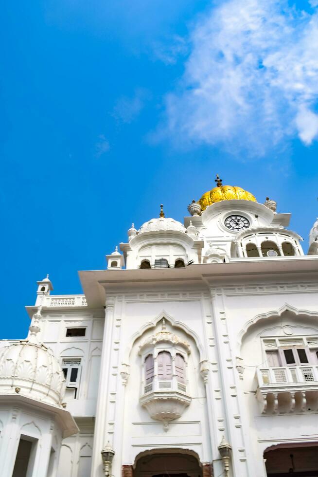 Amritsar, India - May 31 2023 - View of details of architecture inside Golden Temple - Harmandir Sahib in Amritsar, Punjab, India, Famous indian sikh landmark, Golden Temple, the main sanctuary photo