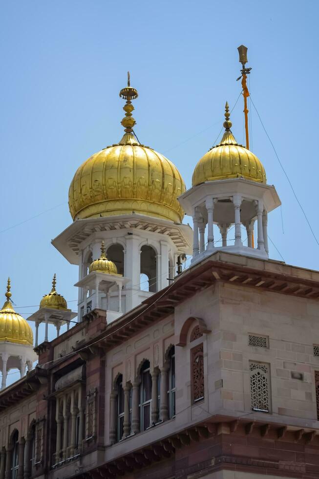 New Delhi, India, May 23 2023 - Gurudwara Sis Ganj Sahib is one of the nine historical Gurdwaras in Old Delhi in India, Sheesh Ganj Gurudwara in Chandni Chowk, opposite Red Fort in Old Delhi India photo