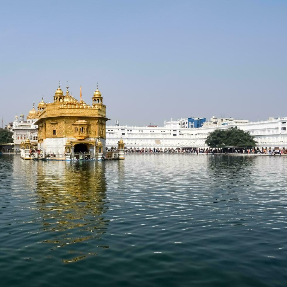 Amritsar, India - May 31 2023 - Beautiful view of Golden Temple - Harmandir Sahib in Amritsar, Punjab, India, Famous indian sikh landmark, Golden Temple, the main sanctuary of Sikhs in Amritsar, India photo