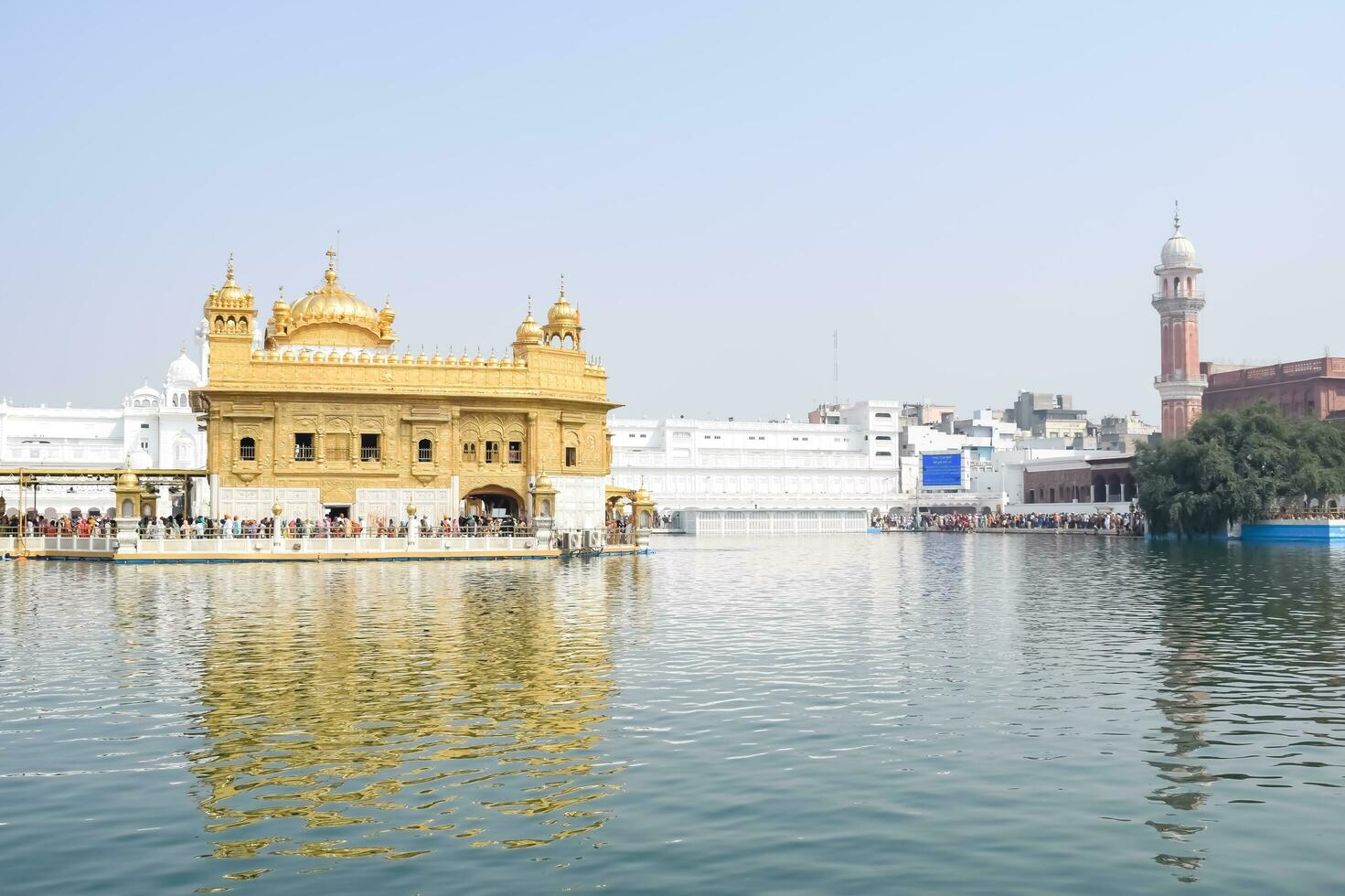 Amritsar, India - May 31 2023 - Beautiful view of Golden Temple - Harmandir Sahib in Amritsar, Punjab, India, Famous indian sikh landmark, Golden Temple, the main sanctuary of Sikhs in Amritsar, India photo