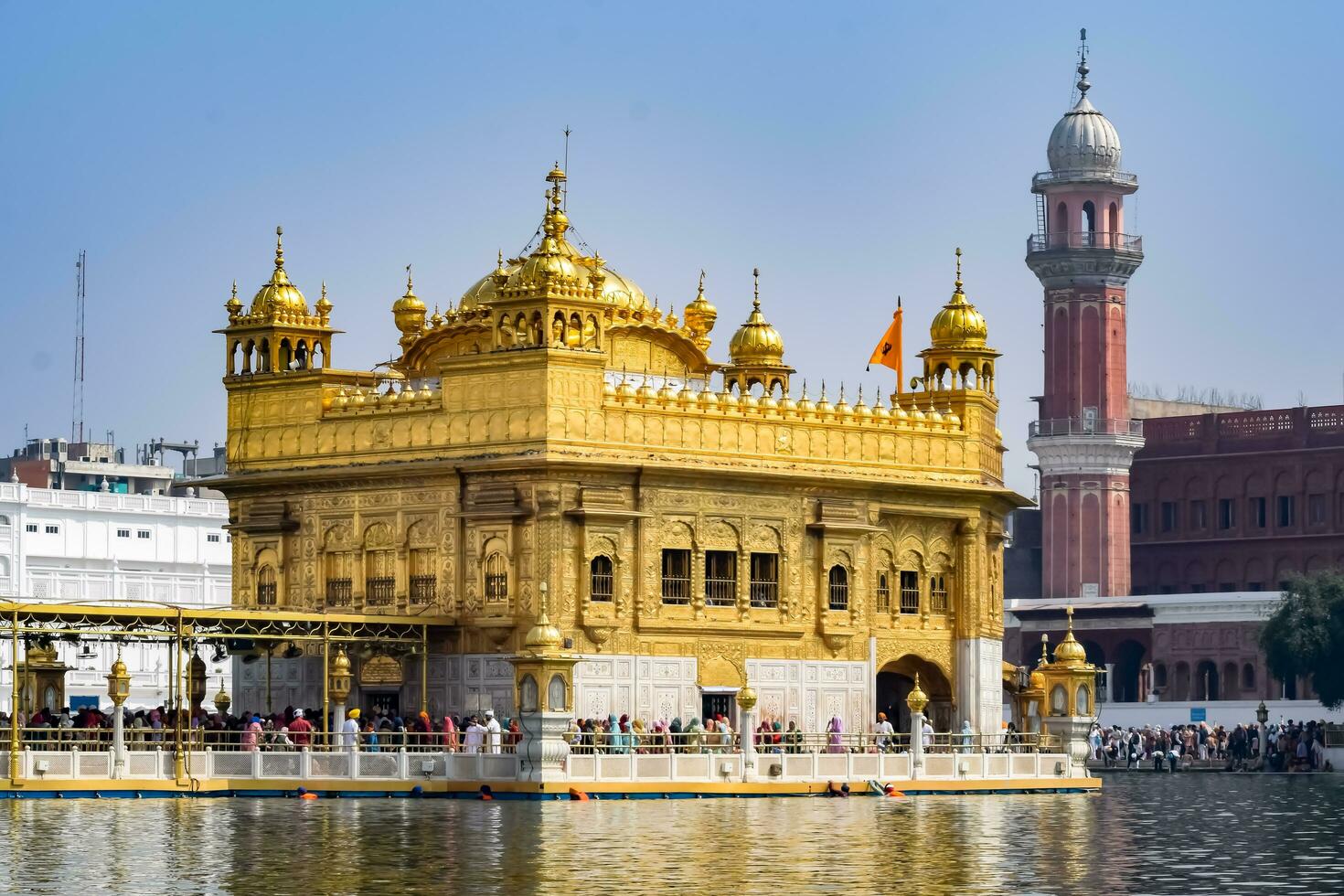 Amritsar, India - May 31 2023 - Beautiful view of Golden Temple - Harmandir Sahib in Amritsar, Punjab, India, Famous indian sikh landmark, Golden Temple, the main sanctuary of Sikhs in Amritsar, India photo