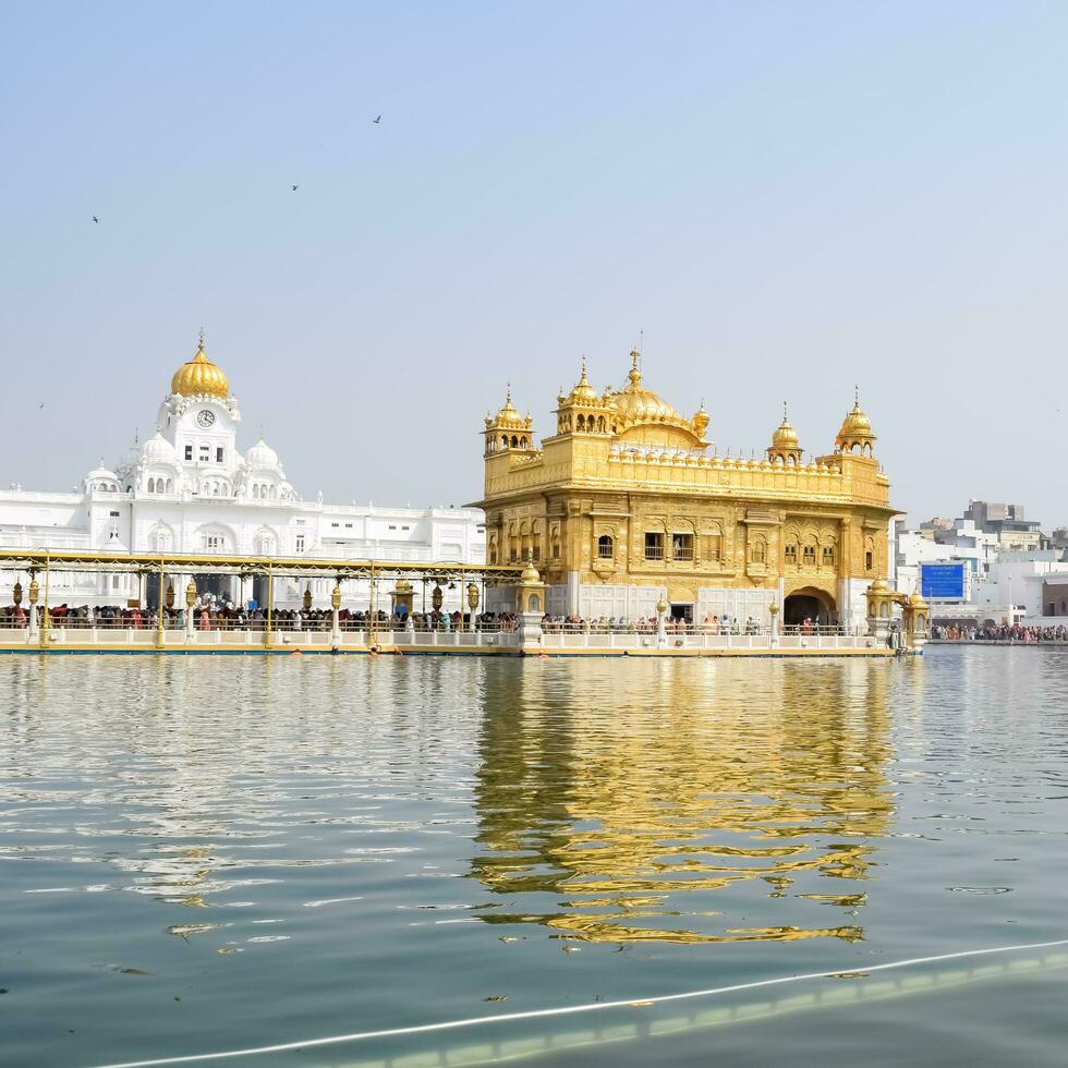 Amritsar, India - May 31 2023 - Beautiful view of Golden Temple - Harmandir Sahib in Amritsar, Punjab, India, Famous indian sikh landmark, Golden Temple, the main sanctuary of Sikhs in Amritsar, India photo