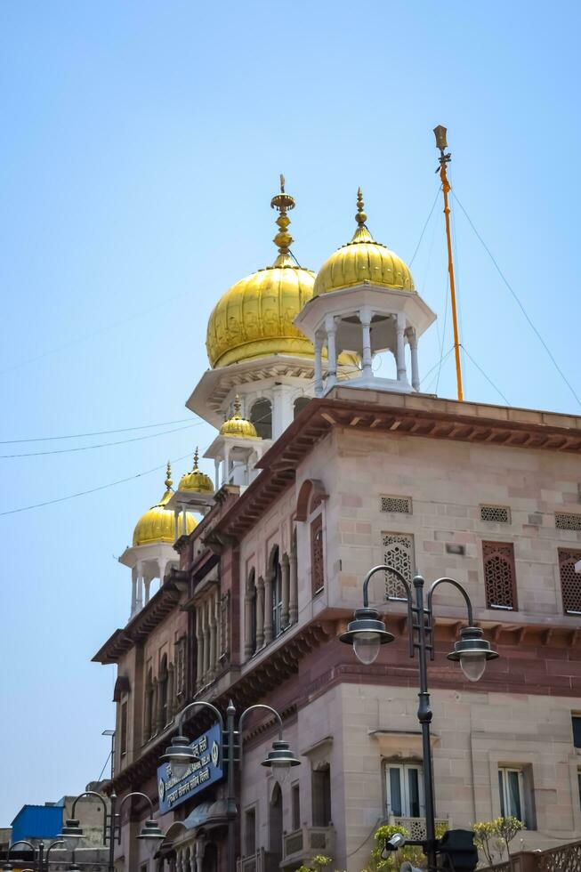 New Delhi, India, May 23 2023 - Gurudwara Sis Ganj Sahib is one of the nine historical Gurdwaras in Old Delhi in India, Sheesh Ganj Gurudwara in Chandni Chowk, opposite Red Fort in Old Delhi India photo