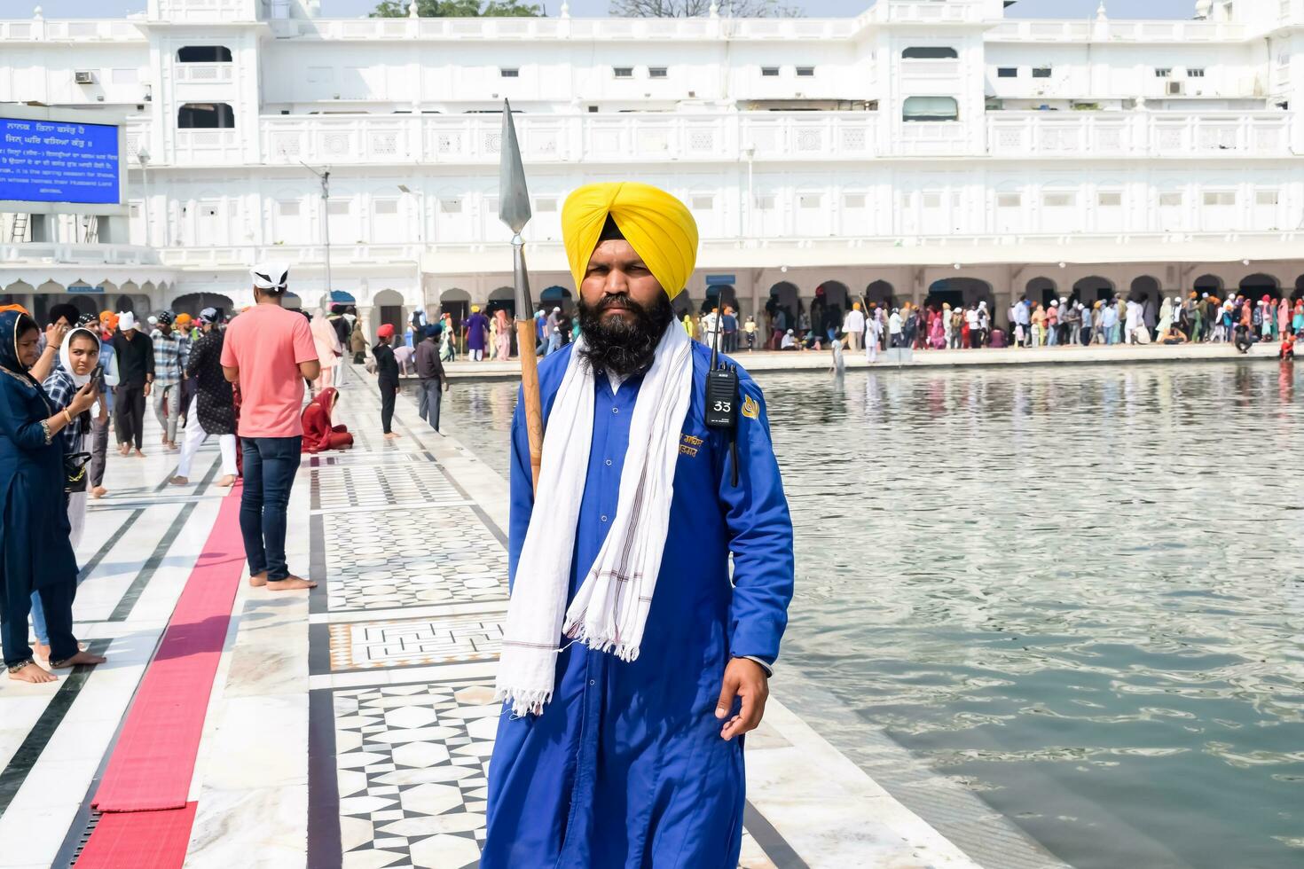 Amritsar, India - February 26 2023 - Unidentified devotees from various parts at Golden Temple Harmandir Sahib in Amritsar, Punjab, India, Famous indian sikh landmark, Golden Temple photo