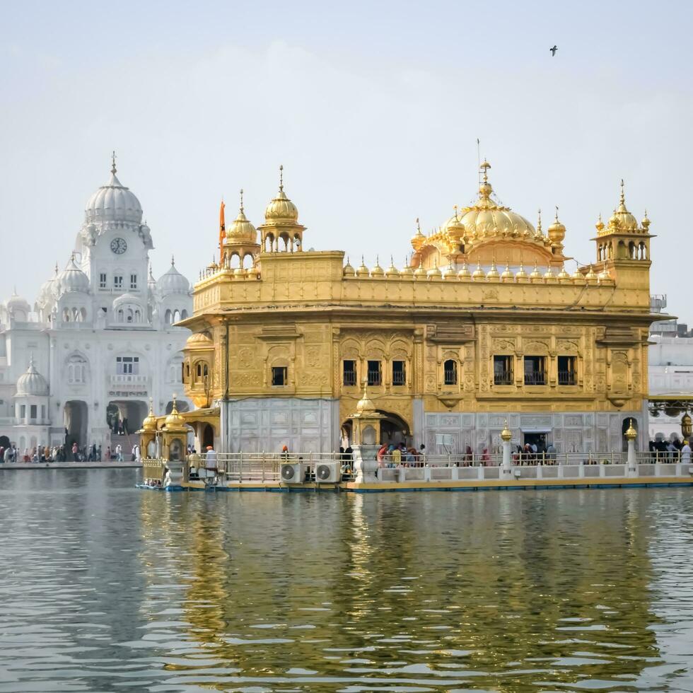 Amritsar, India - May 31 2023 - Beautiful view of Golden Temple - Harmandir Sahib in Amritsar, Punjab, India, Famous indian sikh landmark, Golden Temple, the main sanctuary of Sikhs in Amritsar, India photo