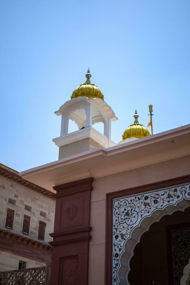 New Delhi, India, May 23 2023 - Gurudwara Sis Ganj Sahib is one of the nine historical Gurdwaras in Old Delhi in India, Sheesh Ganj Gurudwara in Chandni Chowk, opposite Red Fort in Old Delhi India photo