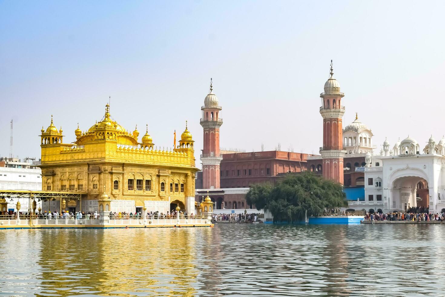 Amritsar, India - May 31 2023 - Beautiful view of Golden Temple - Harmandir Sahib in Amritsar, Punjab, India, Famous indian sikh landmark, Golden Temple, the main sanctuary of Sikhs in Amritsar, India photo