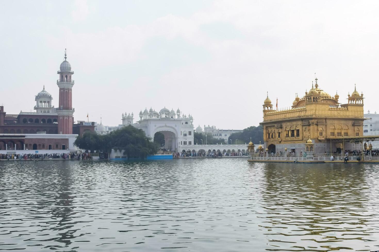 Amritsar, India - May 31 2023 - Beautiful view of Golden Temple - Harmandir Sahib in Amritsar, Punjab, India, Famous indian sikh landmark, Golden Temple, the main sanctuary of Sikhs in Amritsar, India photo
