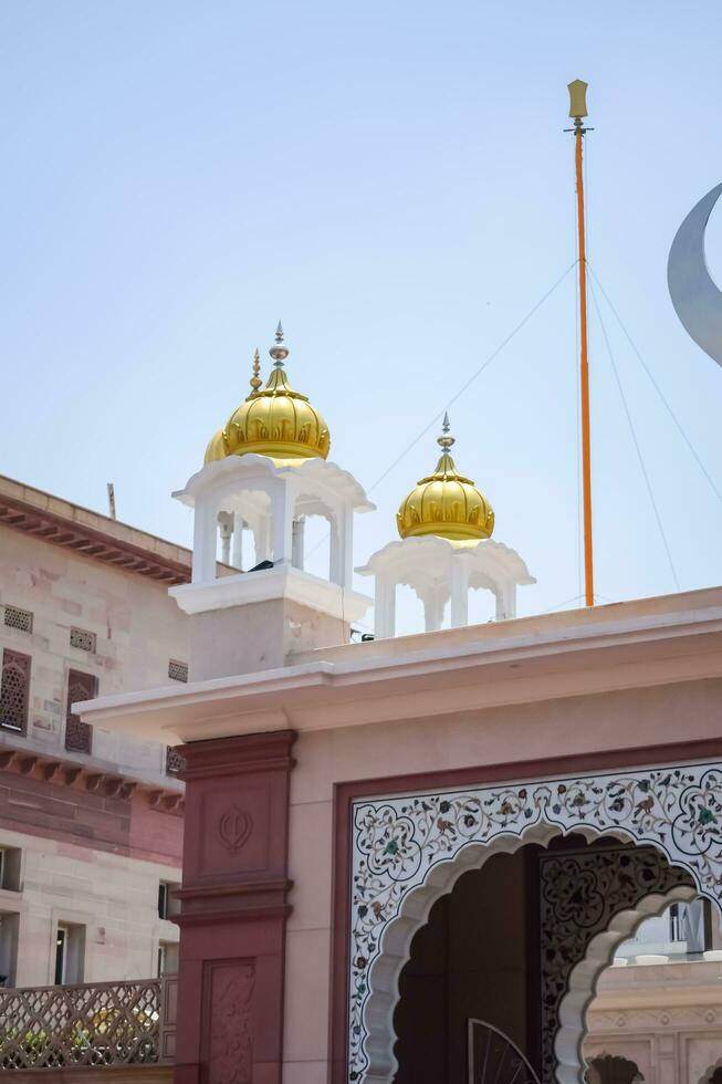 New Delhi, India, May 23 2023 - Gurudwara Sis Ganj Sahib is one of the nine historical Gurdwaras in Old Delhi in India, Sheesh Ganj Gurudwara in Chandni Chowk, opposite Red Fort in Old Delhi India photo