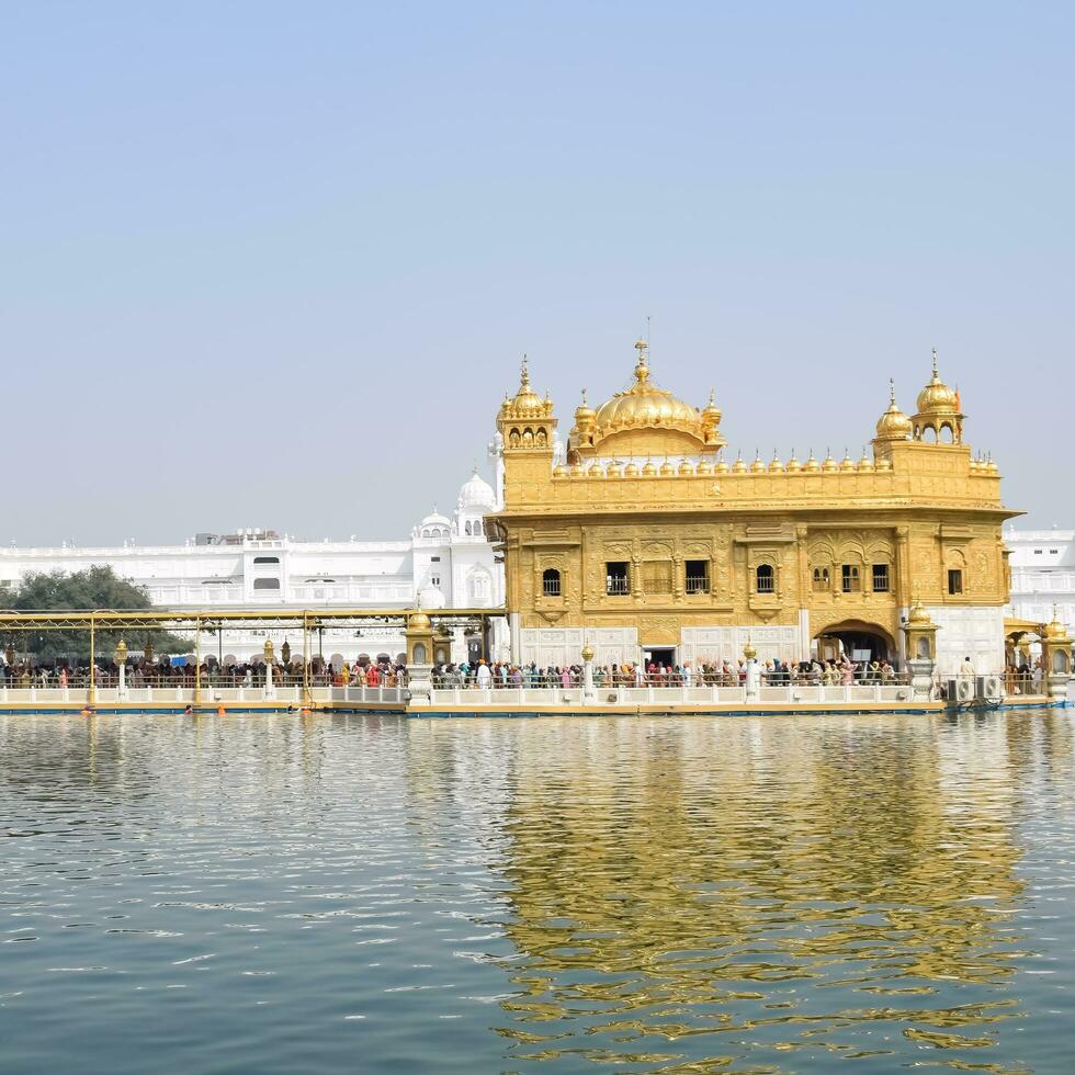 Amritsar, India - May 31 2023 - Beautiful view of Golden Temple - Harmandir Sahib in Amritsar, Punjab, India, Famous indian sikh landmark, Golden Temple, the main sanctuary of Sikhs in Amritsar, India photo