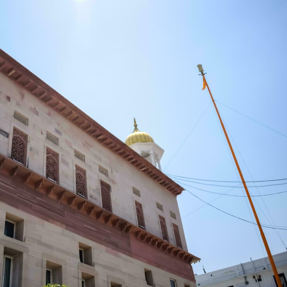 New Delhi, India, May 23 2023 - Gurudwara Sis Ganj Sahib is one of the nine historical Gurdwaras in Old Delhi in India, Sheesh Ganj Gurudwara in Chandni Chowk, opposite Red Fort in Old Delhi India photo