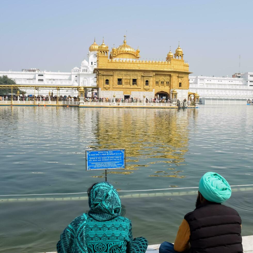Amritsar, India - May 31 2023 - Beautiful view of Golden Temple - Harmandir Sahib in Amritsar, Punjab, India, Famous indian sikh landmark, Golden Temple, the main sanctuary of Sikhs in Amritsar, India photo