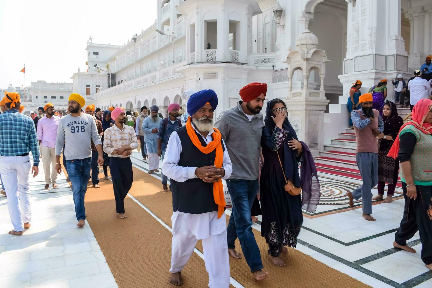 Amritsar, India - February 26 2023 - Unidentified devotees from various parts at Golden Temple Harmandir Sahib in Amritsar, Punjab, India, Famous indian sikh landmark, Golden Temple photo