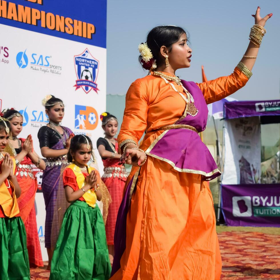 New Delhi, India - July 01 2023 - Bharathanatyam Indian classical odissi dancers performing at stage. Beautiful Indian girl dancers in the posture of Indian dance. Indian classical dance Bharatanatyam photo