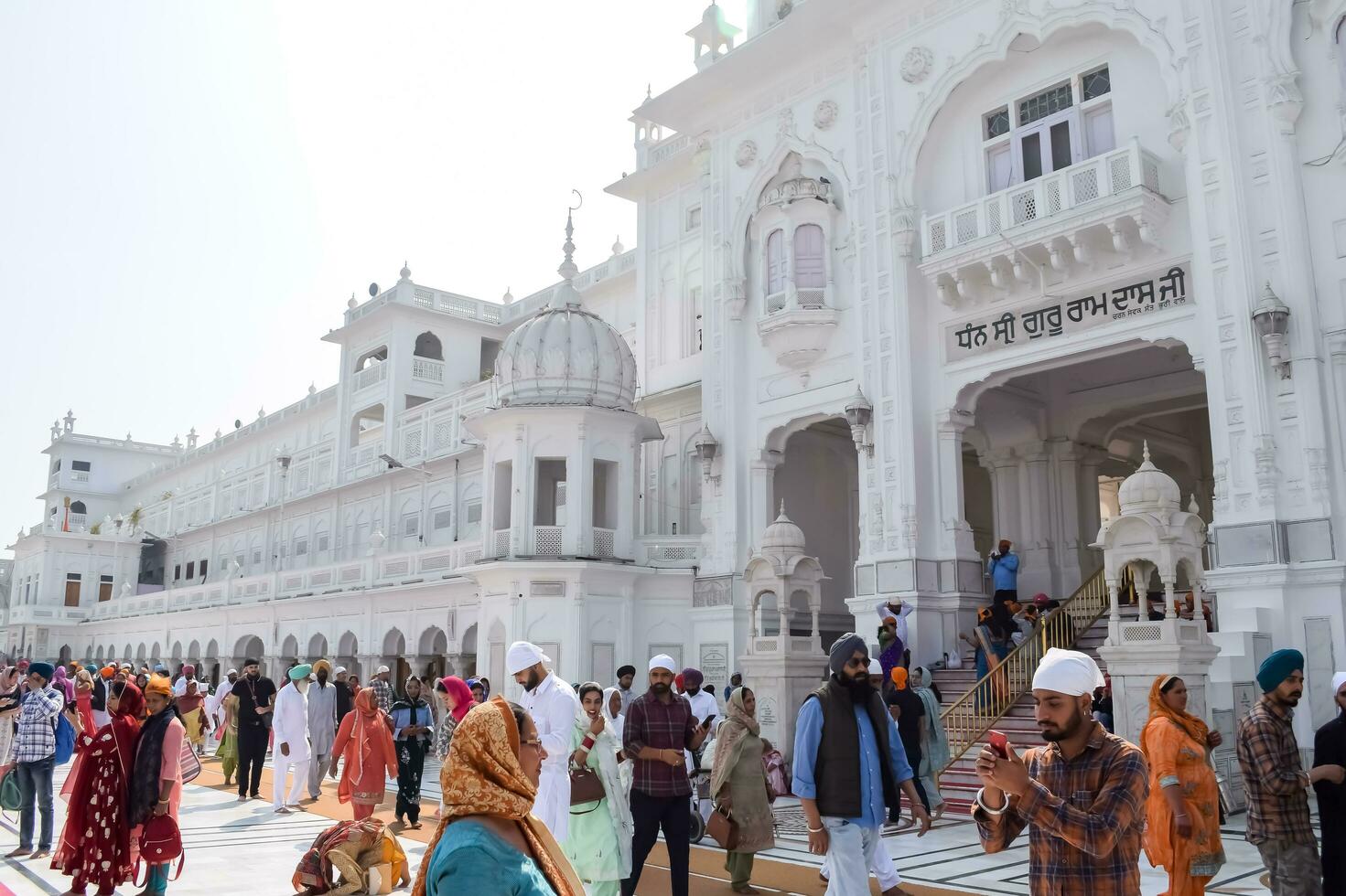 Amritsar, India - February 26 2023 - Unidentified devotees from various parts at Golden Temple Harmandir Sahib in Amritsar, Punjab, India, Famous indian sikh landmark, Golden Temple photo