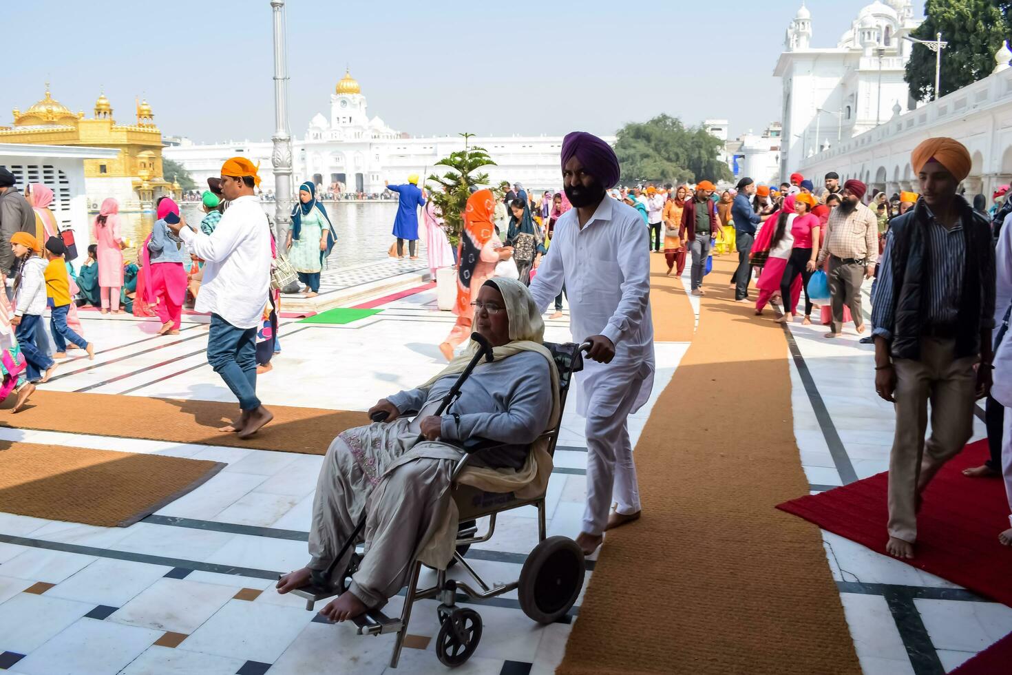 Amritsar, India - February 26 2023 - Unidentified devotees from various parts at Golden Temple Harmandir Sahib in Amritsar, Punjab, India, Famous indian sikh landmark, Golden Temple photo