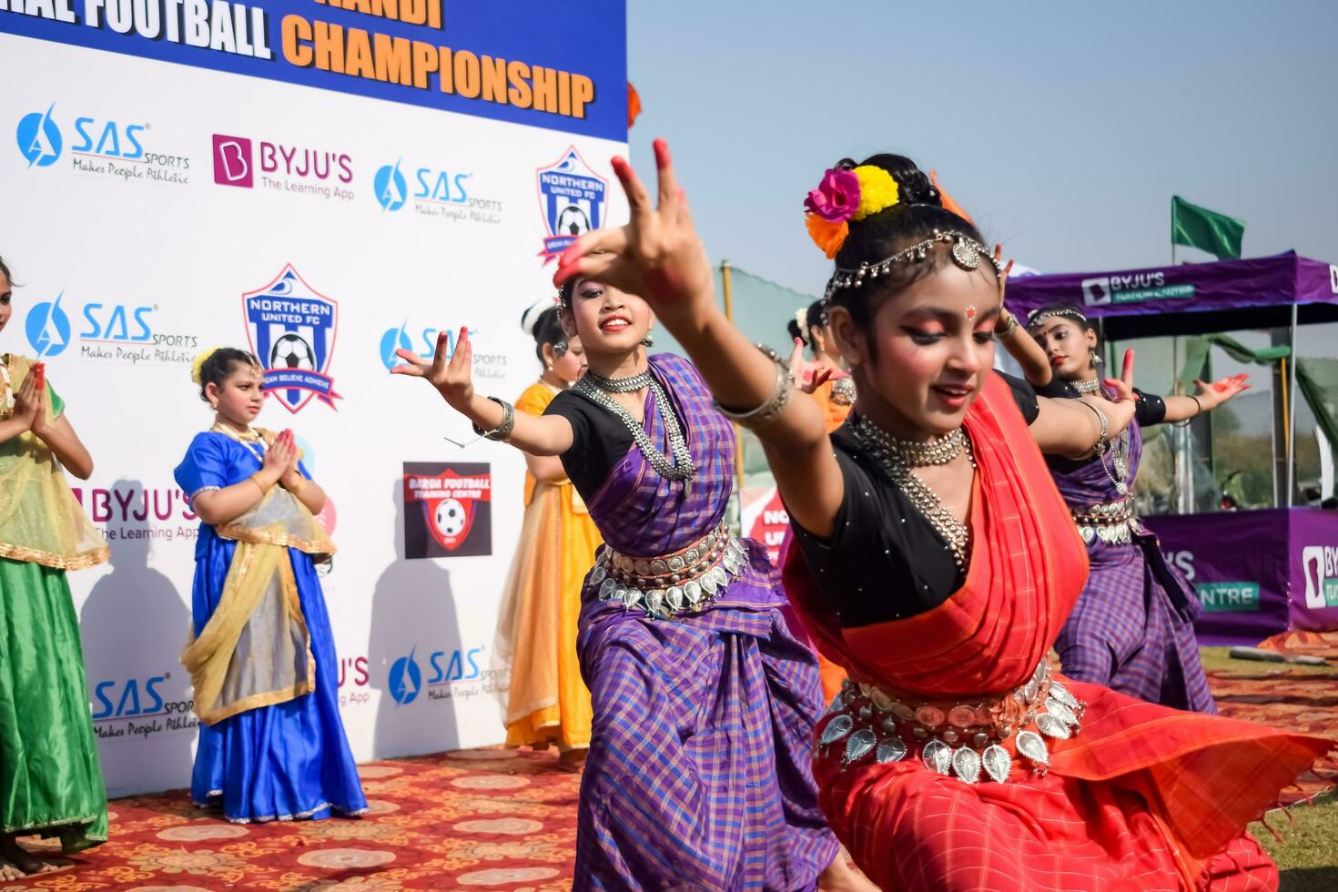 New Delhi, India - July 01 2023 - Bharathanatyam Indian classical odissi dancers performing at stage. Beautiful Indian girl dancers in the posture of Indian dance. Indian classical dance Bharatanatyam photo