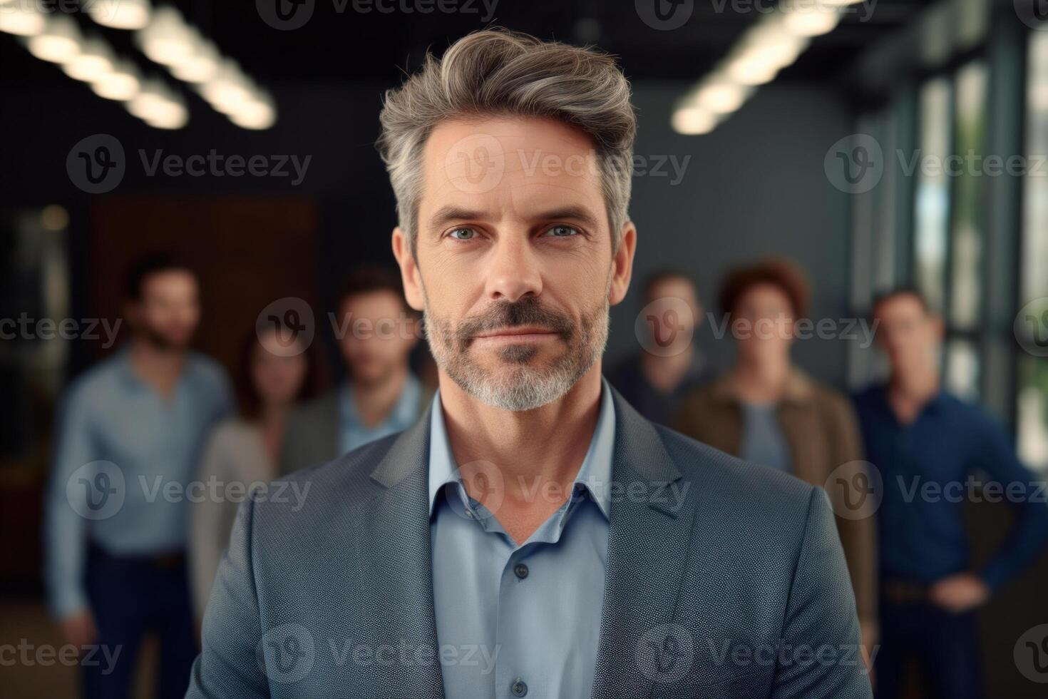 Successful Caucasian Businessman Standing in front of Team, Smiling at Camera. photo