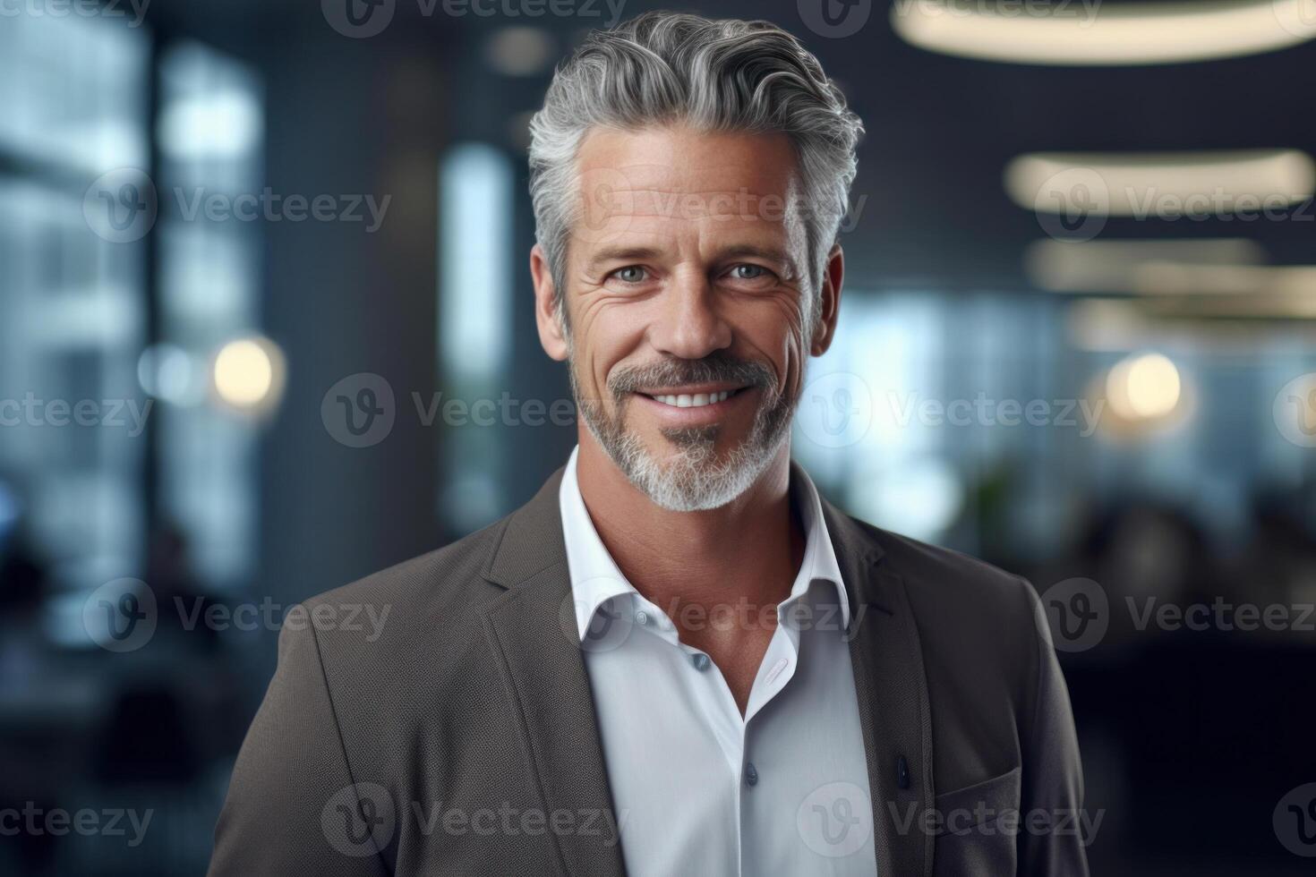 Purposeful Top Manager Standing at the Office and Smiling at Camera. photo