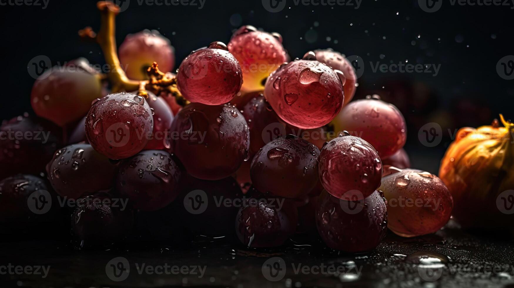 Fresh Grape fruits hit by splashes of water with black blur background, photo