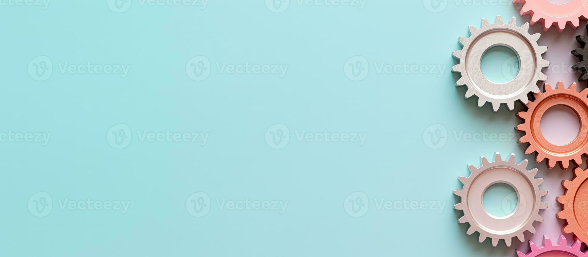 Photo of colorful gears on a vibrant blue background with copy space