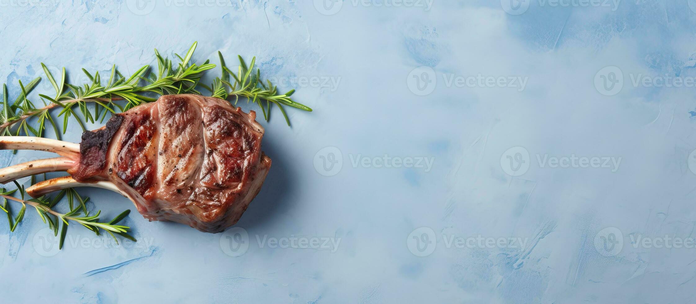 foto de un delicioso filete con Romero adornar en un vibrante azul antecedentes con Copiar espacio