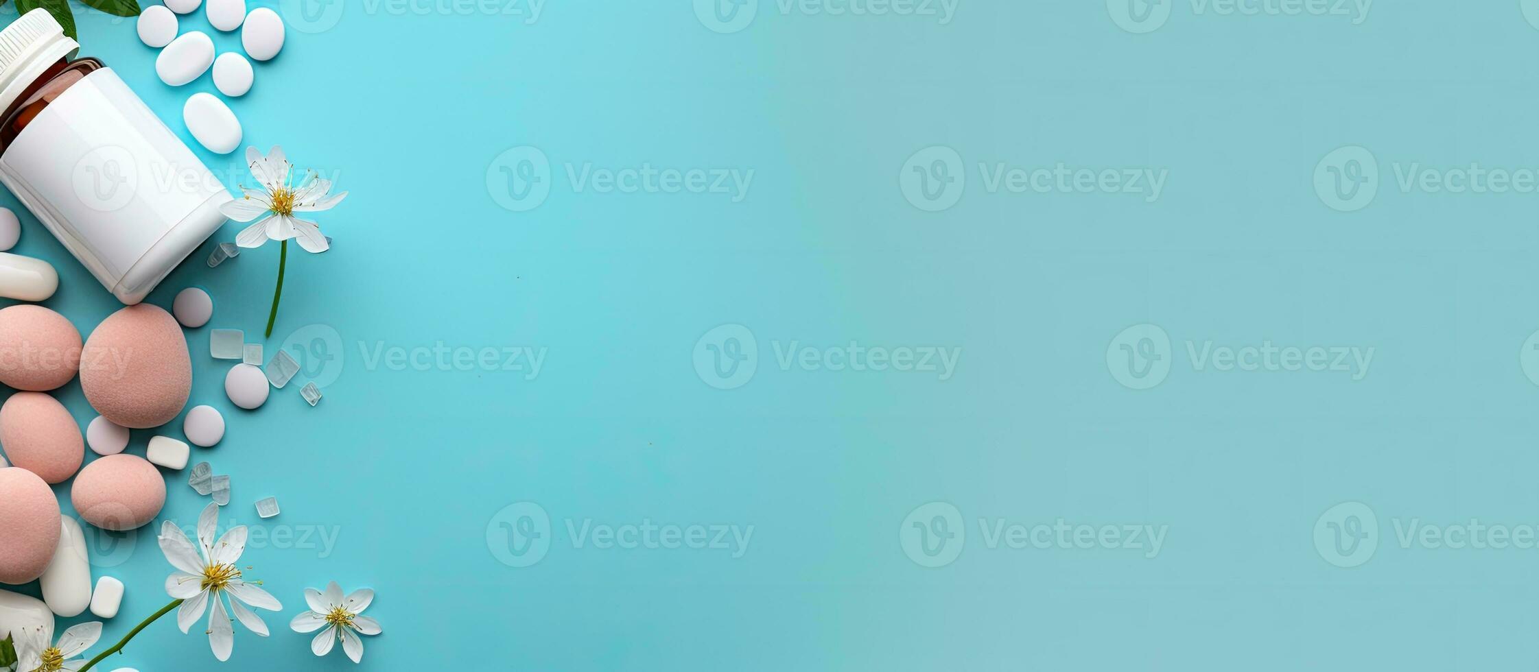 Photo of a bottle of pills and flowers on a blue background with empty space for text or design with copy space