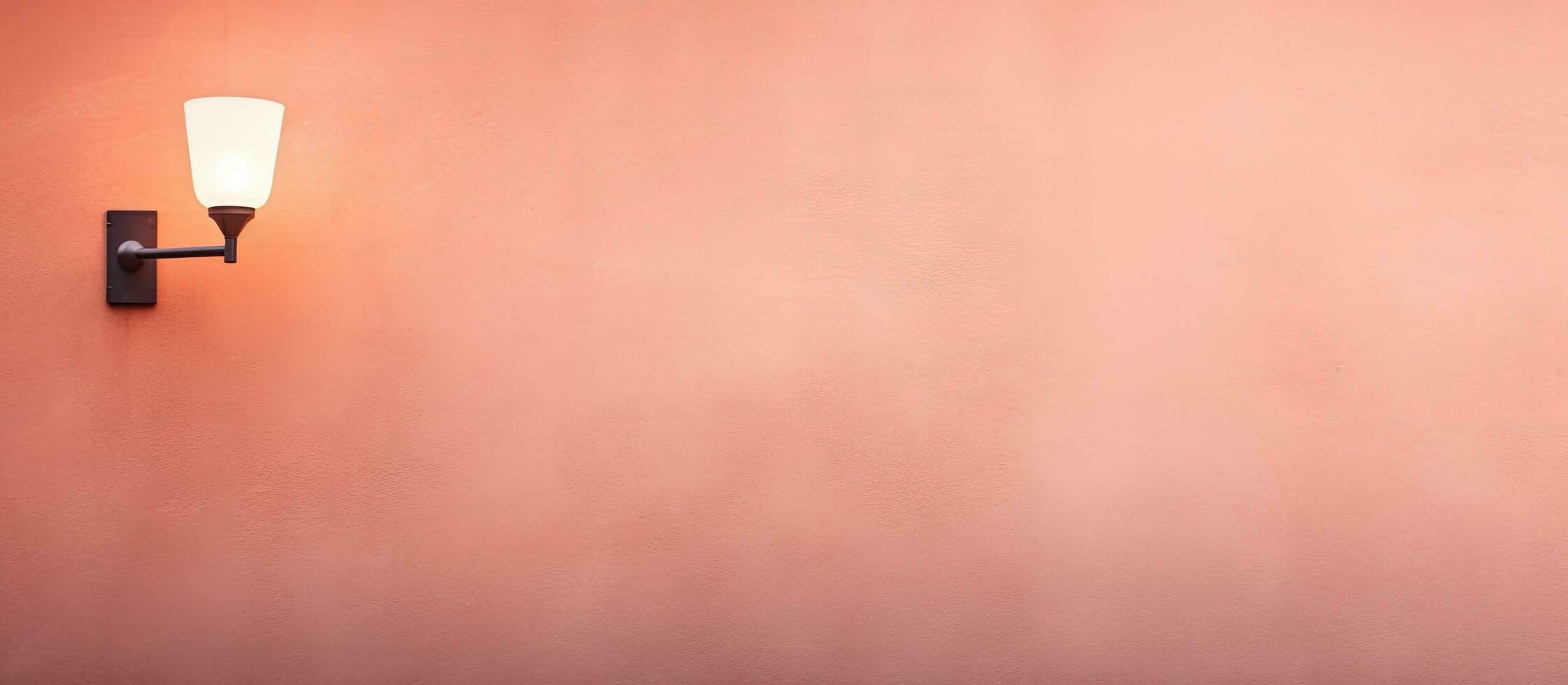 Photo of a pink wall with a stylish wall mounted light fixture with copy space