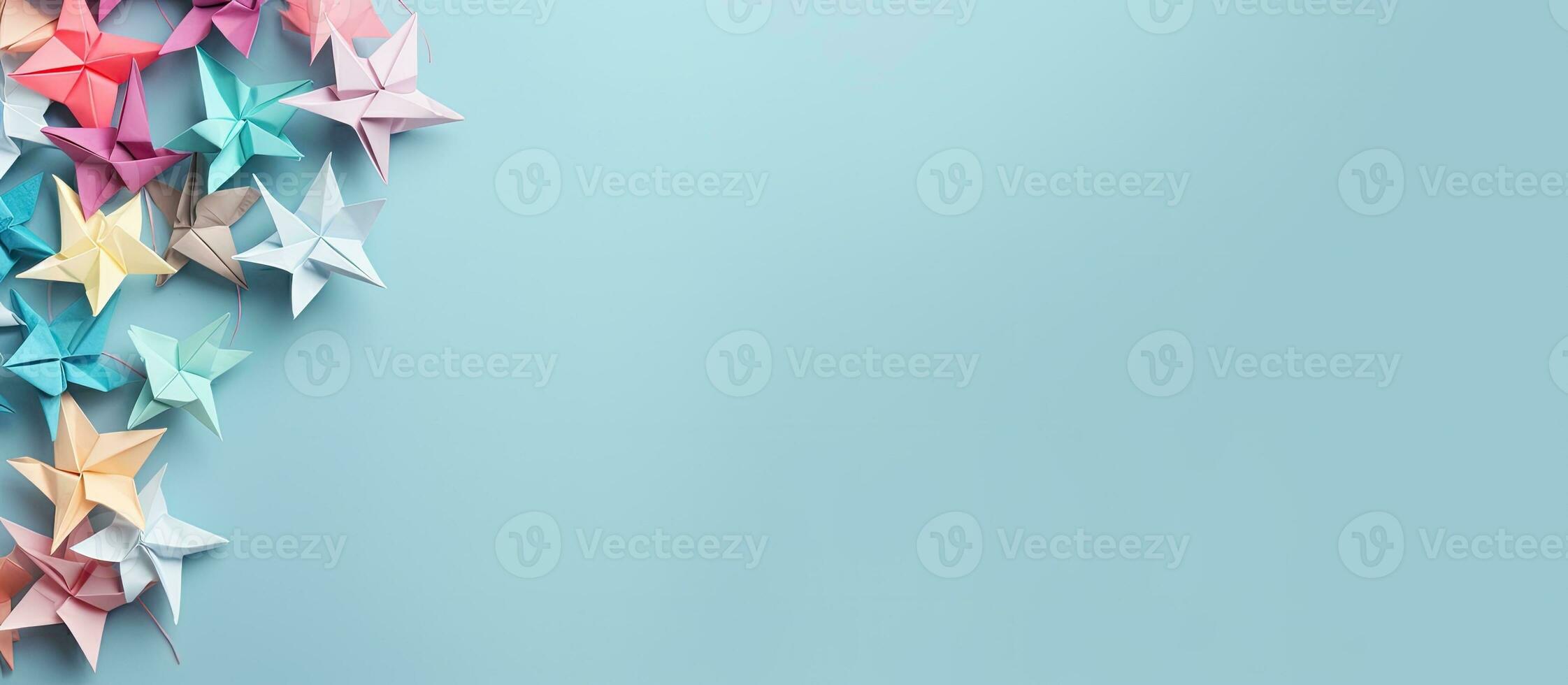 Photo of origami stars on a vibrant blue background with copy space