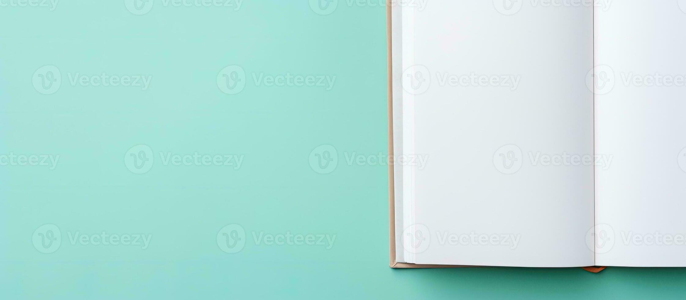 Photo of an open book on a wooden table with plenty of space for writing or drawing with copy space