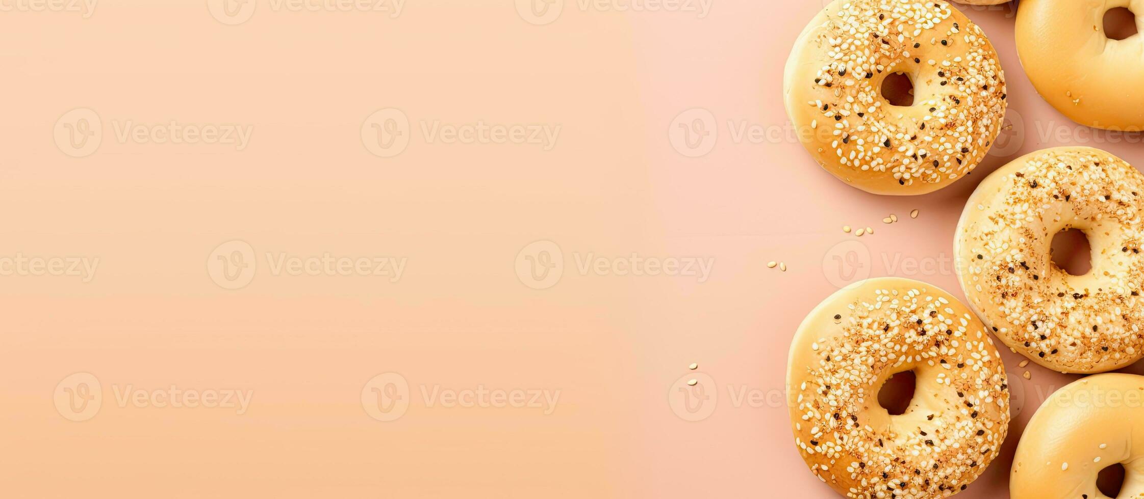 Photo of delicious donuts on a vibrant pink background with copy space