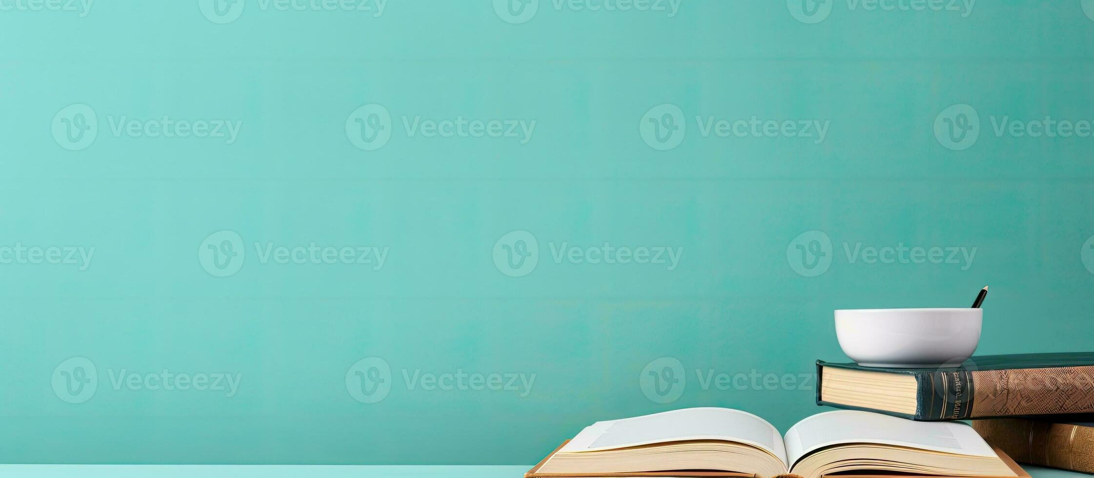 Photo of an open book and a cup of coffee on a table, offering a cozy and inviting atmosphere with copy space