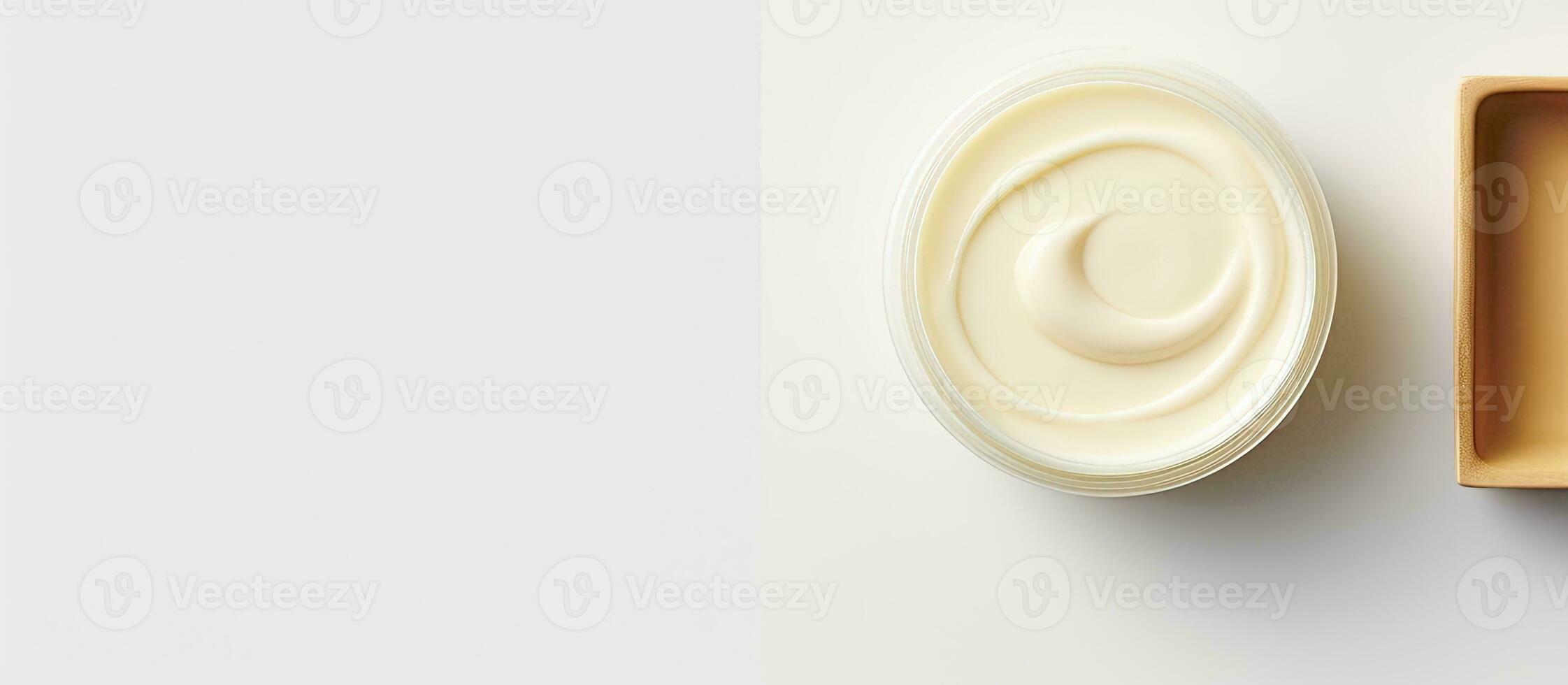 Photo of a bowl of yogurt and a container of yogurt with copy space with copy space
