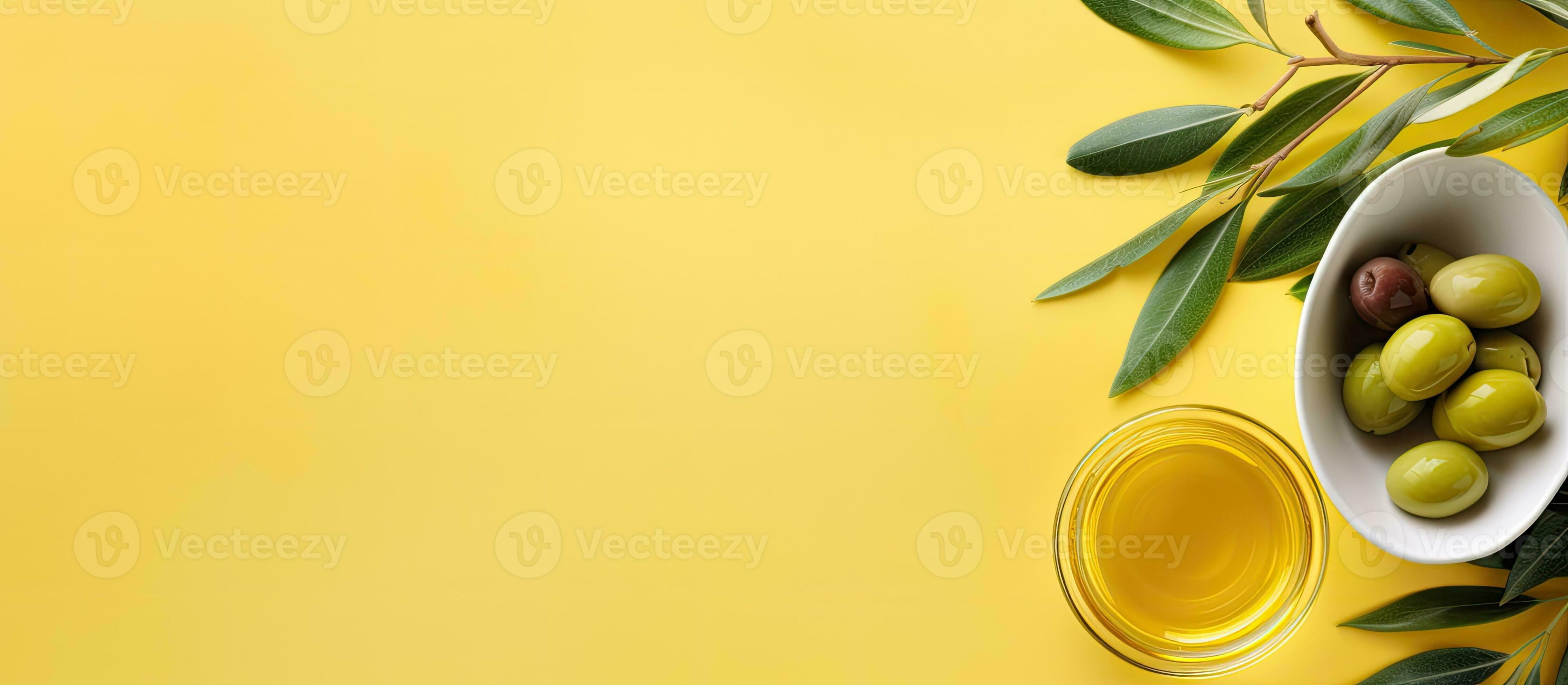 Photo of olives in a white bowl on a yellow background with plenty of