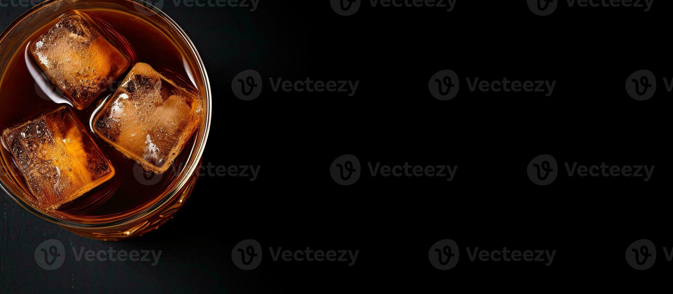 Photo of three ice cubes in a glass on a black background with ample space for text or design elements with copy space
