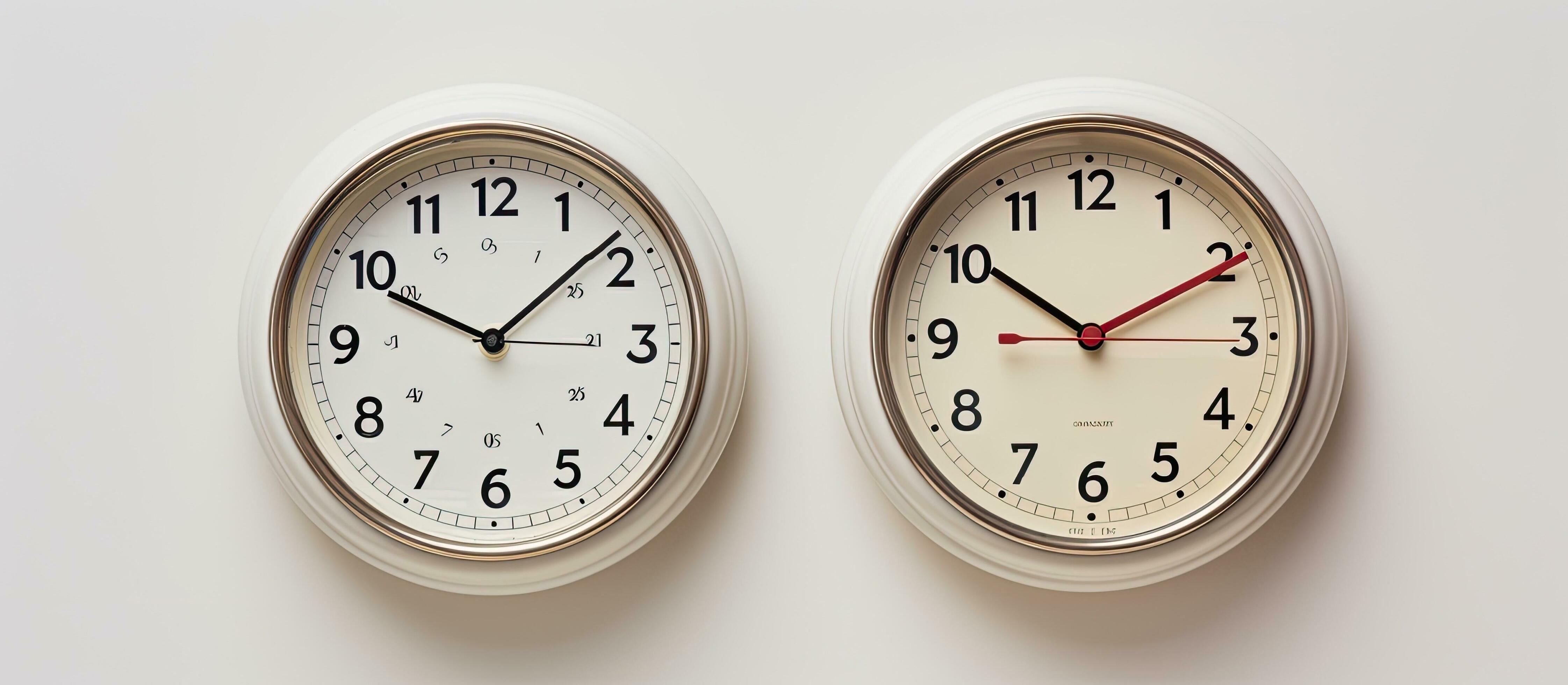 Photo of two clocks side by side with empty space in between with copy space 26859555 Stock