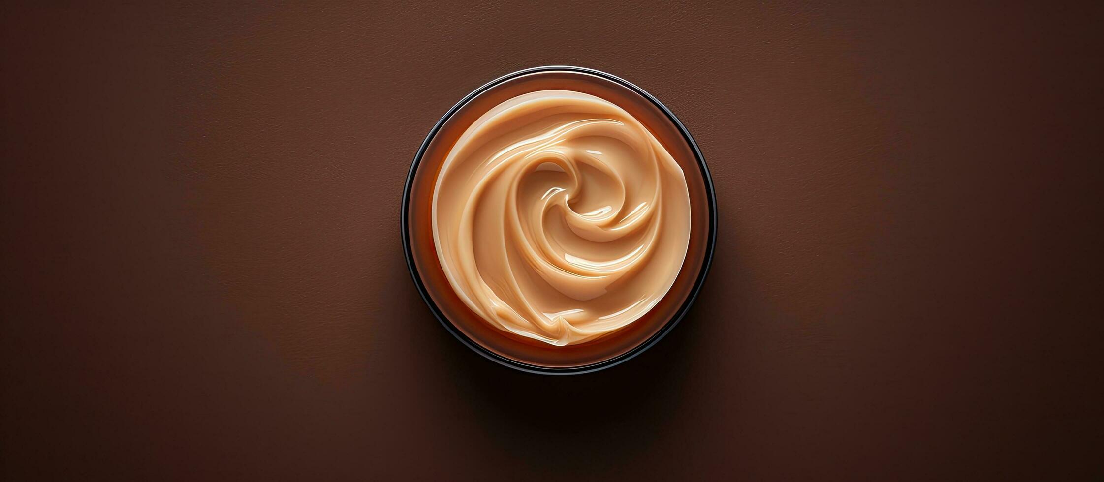 Photo of a cup of cream on a brown background with empty space for text or design elements with copy space