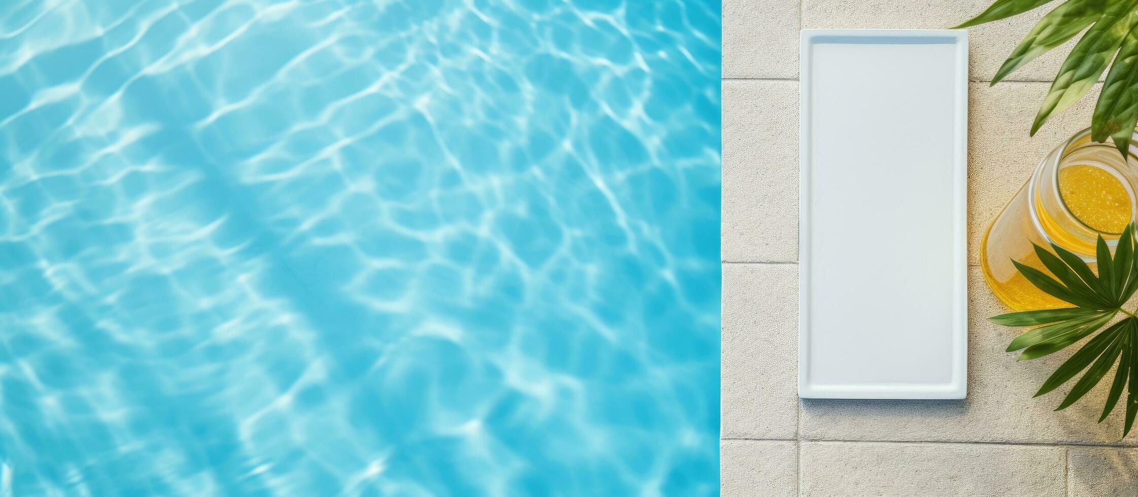 Photo of a refreshing glass of orange juice by the poolside with copy space