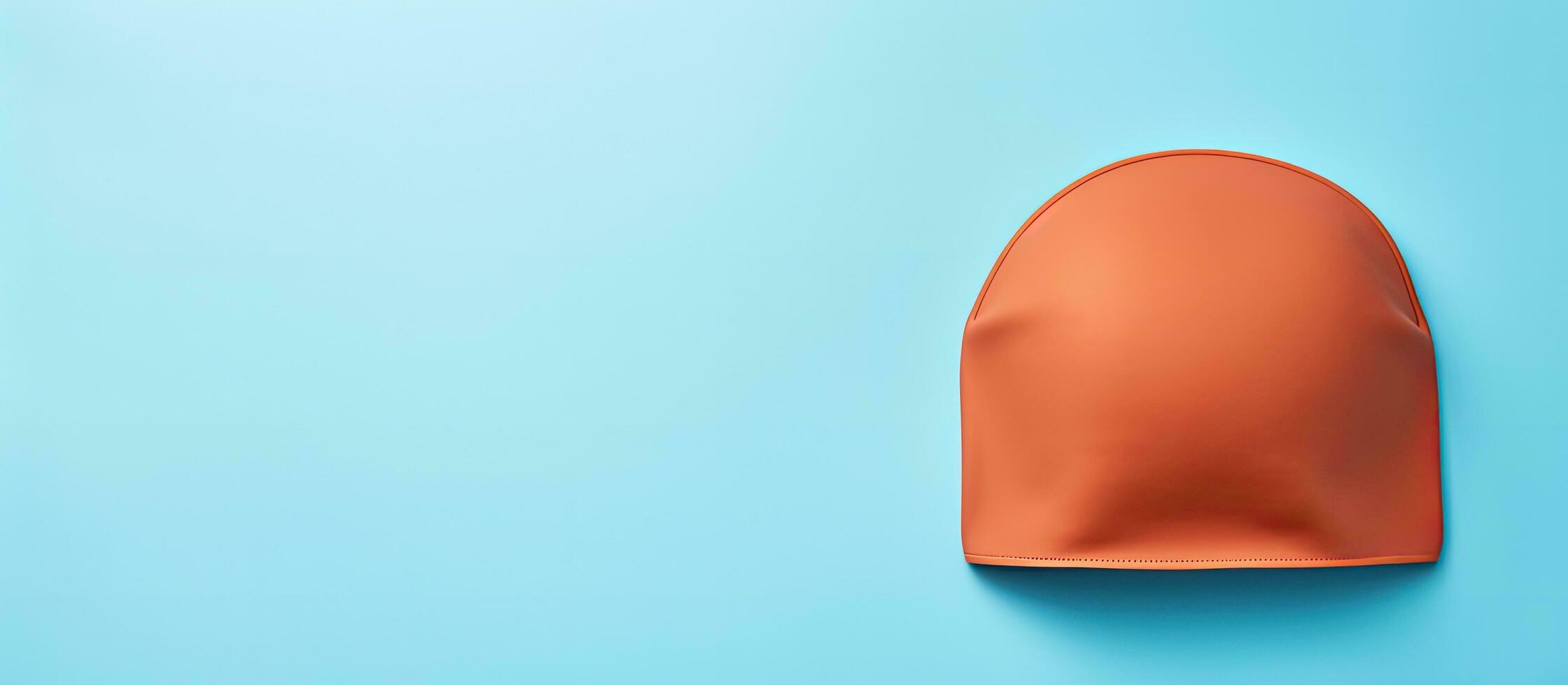 Photo of a vibrant orange object against a striking blue background with ample copy space with copy space