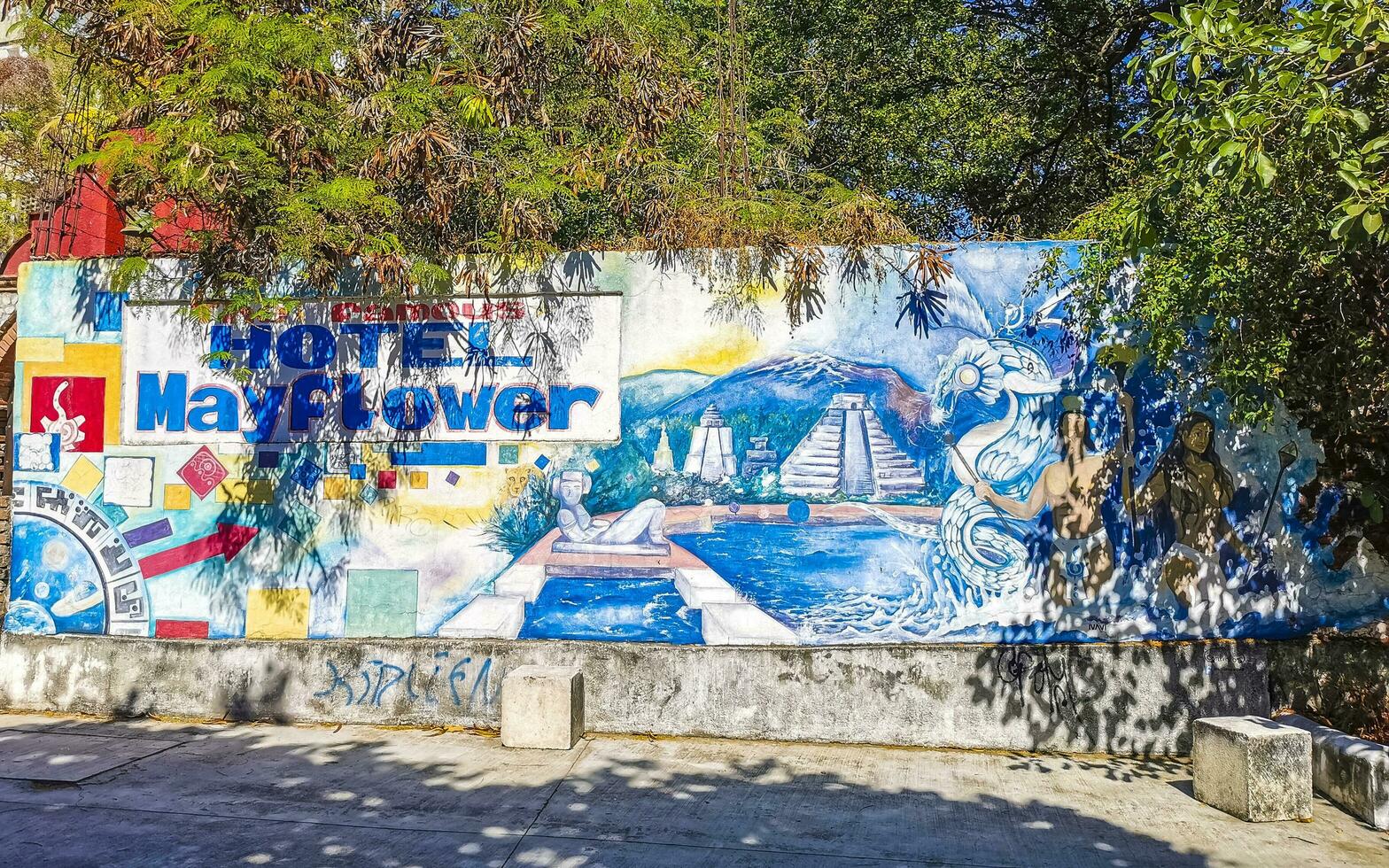 Puerto Escondido Oaxaca Mexico 2023 Wall with map arrow graffiti art drawings paintings in Mexico. photo