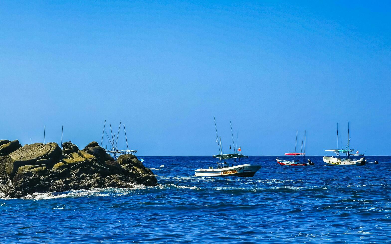 Puerto Escondido Oaxaca Mexico 2023 Boats harbor yacht beach people Puerto Angelito Puerto Escondido Mexico. photo